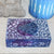 Decorative box with floral patterns on a textured surface