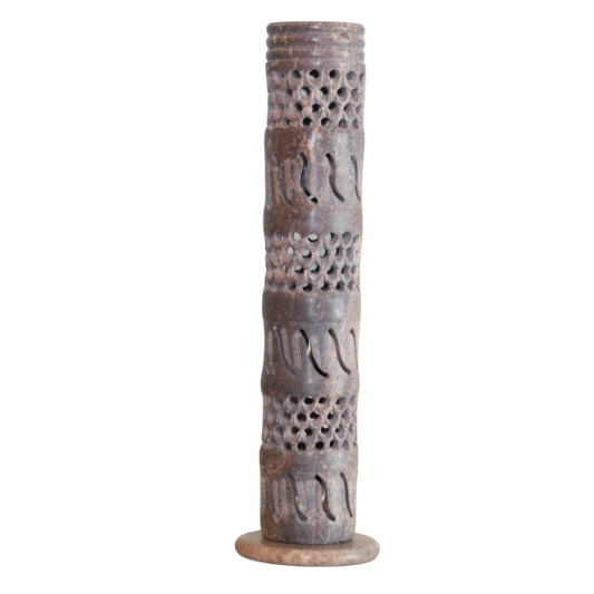 Decorative cylindrical object with intricate patterns on a white background